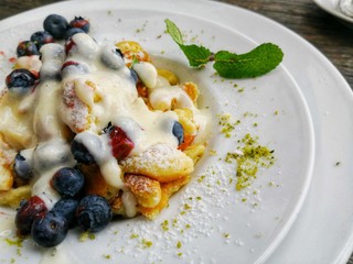 Kaiserschmarrn Austrian dessert traditional dish with scrambled pancakes and fruits