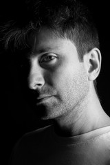 Seductive portrait of young and bearded man