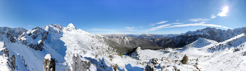 Fototapeta na wymiar Panorama Look From The Stuiben Over Garmisch-Partenkirchen And Zugspitze On A Sunny Winter Day