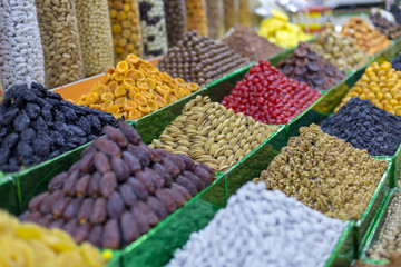 Market stall with various dried fruits and nuts