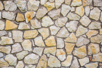 wall, finished with rubble stone, stone texture