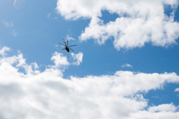 helicopter in flight against a cloudy sky
