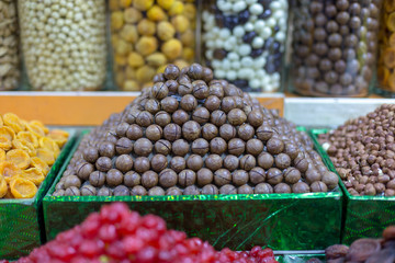 Market stall with various dried fruits and nuts