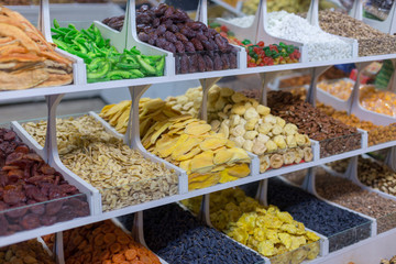 Market stall with various dried fruits and nuts