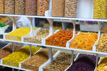 Market stall with various dried fruits and nuts