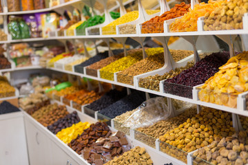 Market stall with various dried fruits and nuts
