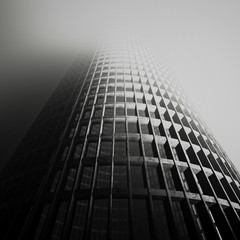 Fototapeta premium design element. 3d illustration. rendering. abandoned conrete skyscraper in gray fog black and white