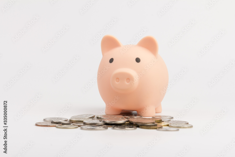 Wall mural pink piggy bank with russian ruble coins close up.pink piggy bank isolated on white background. conc