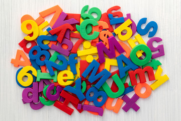 Pile of coloured magnetic letters and numbers
