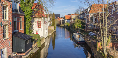 Fototapeta na wymiar Panorama of the Damsterdiep river in the historic part of Appingedam, Netherlands
