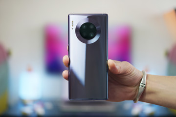 Man hand holding the newest smartphone