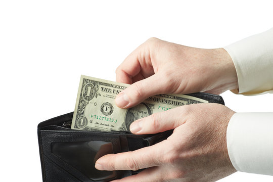 Closeup of a man puts 1 dollar in his wallet.