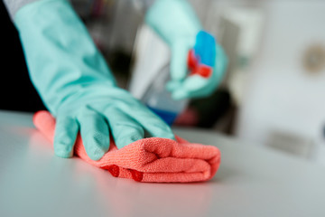 man cleaning a white table