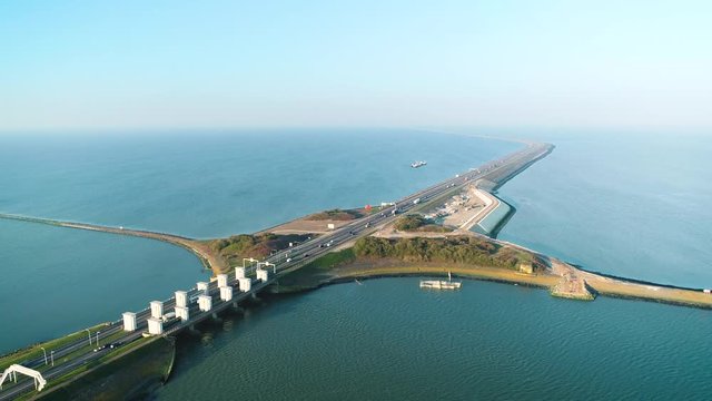 Enclosure Dam (Afsluitdijk): A Stream of Cars and Trucks Driving Across the Enclosure Dam - Friesland, Netherlands / Holland &ndash; 4K Drone Footage