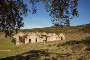 Fototapeta na wymiar Abandoned mining town buildings in Cerro de Hierro national park in Sevilla Spain