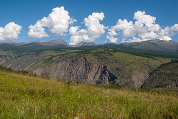 View of mountains, sky and clouds in Altai, Siberia, on the Katu-Yaryk pass in summer