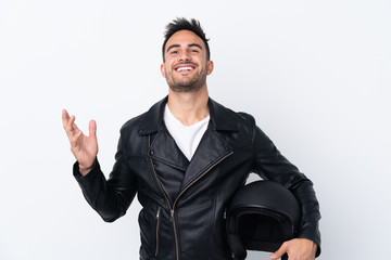 Man with a motorcycle helmet smiling a lot