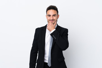 Young business man over isolated background laughing