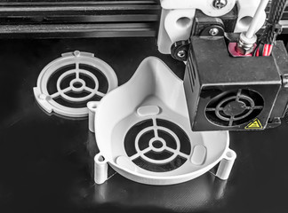 A coronavirus mask is printed on a 3D printer.