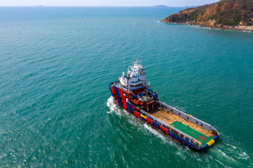 tug boat sailing on the green sea