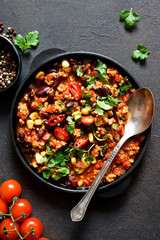Chili con carne classic mexican dish on the kitchen table, top view.