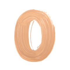 Letter O made with face skin concealer nude color.  Brush stroke make up base creamy texture isolated on white background.