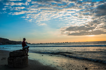 model on the beach at sunset