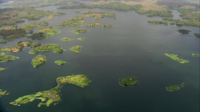 Aerial view of Lake Bayano, small islands with palms and cloud forest in Panama Central America, filmed with Cineflex stabilization 5-Axis camera system