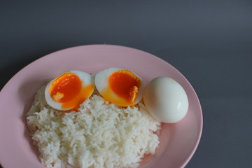 Boiled duck egg and Jasmine rice on a plate, Cheap Thai food