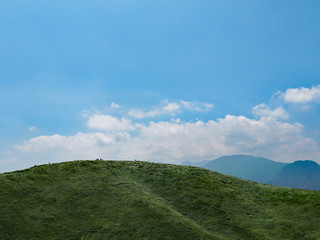 Fototapeta na wymiar Grassland and Blue Sky (Omuroyama, Ito, Shizuoka, Japan)