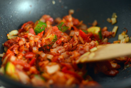 Cooking Colourful Vegetables with Tomato Passata for dinner