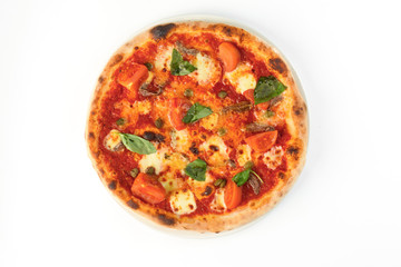 Pizza with tomatoes, cheese and basil on white isolated background