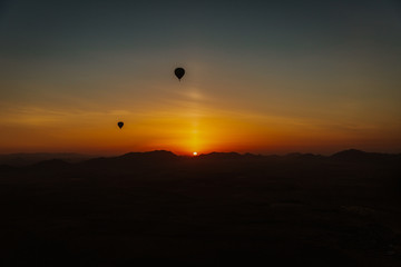Beautiful sunrise from the sky with hot air balloons in Marrakesh, Morocco, North Africa