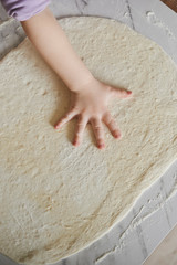 dough and kid's hand