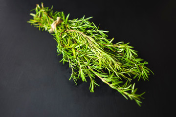 Fresh bunch of rosemary on a black background