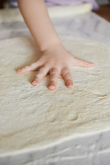 dough and kid's hand