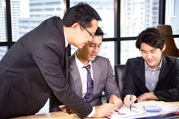 Business man teamwork meeting and discuss at desk in the office.