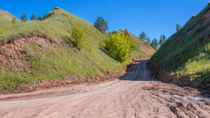 dirt road going up the ravine