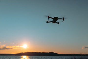 Drone on a sunset background. There is a place for text