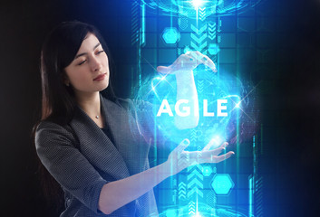 Business, Technology, Internet and network concept. Young businessman working on a virtual screen of the future and sees the inscription: Agile
