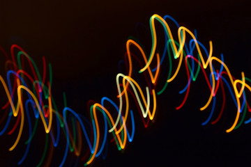 multi-colored light streaks in the dark, illumination