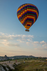 Obraz premium Hot Air balloons flying over amazing rock forms in Cappadocia