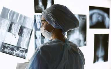 Two female women medical doctors looking at x-rays in a hospital