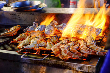 Grilled lobster and squid street food  at Hua Hin night market Thailand