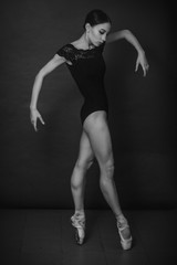 Fototapeta premium black and white vintage dramatic portrait of a dancing girl-ballerina