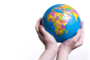 Earth in child hand. World protection concept. Globe in hands isolated on white background. 