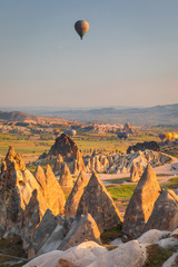 Naklejka premium Hot Air balloons flying over amazing rock forms in Cappadocia