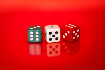 Dice on red backgroud with reflection