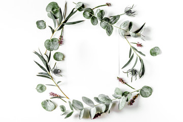 Fototapeta premium Modern spring design with plants on white background top view mock-up