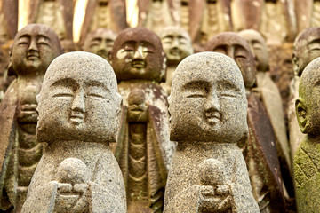 Fototapeta na wymiar Many stone statues of budha in Japan